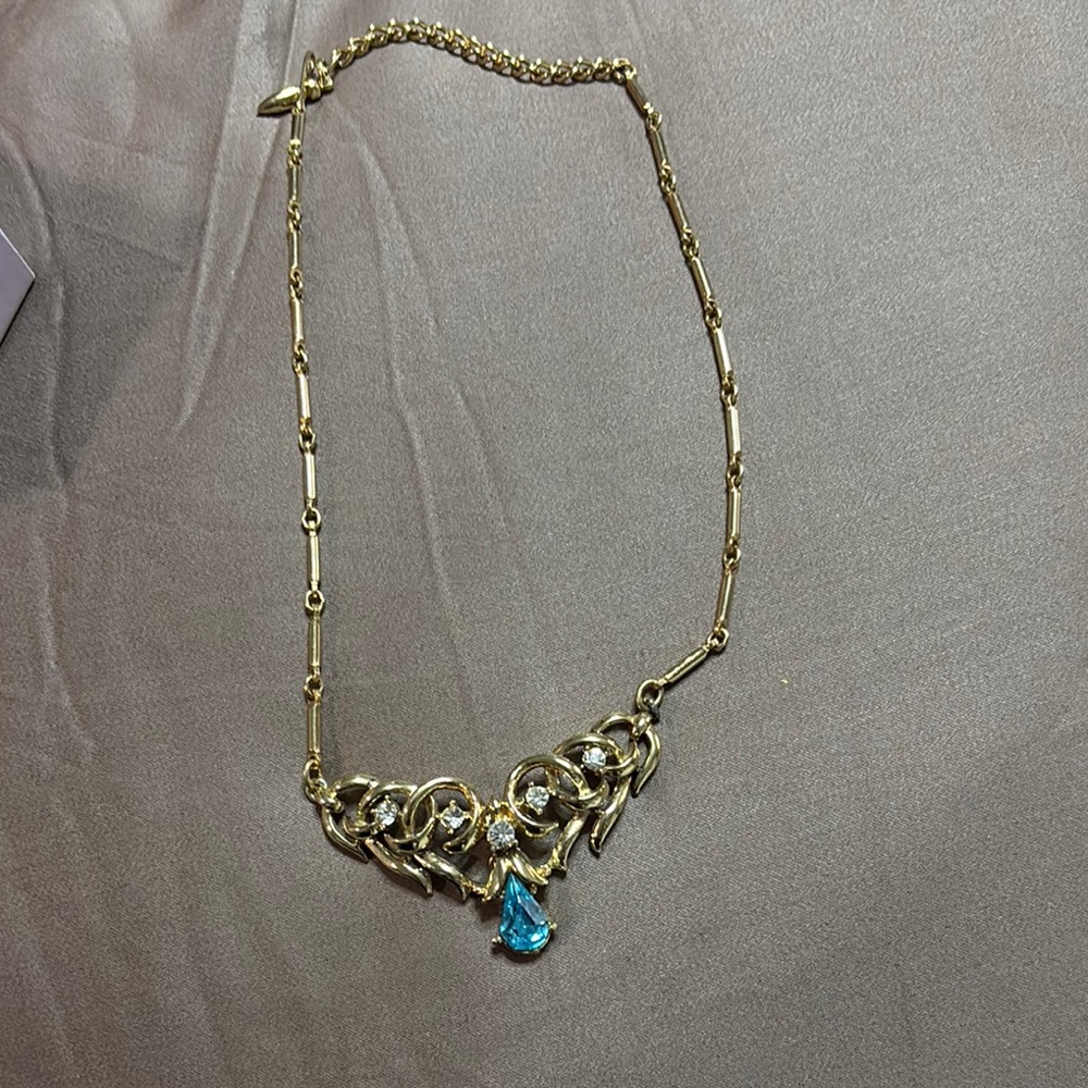 Elegant Gold Necklace with Blue Gemstone